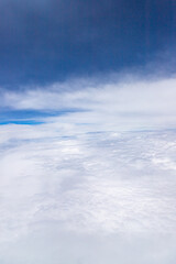 Fototapeta premium White fluffy clouds with a dark cloud on top