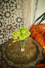 Anastasia Green Chrysanthemum bouquet in crystal vase on ornate tray table