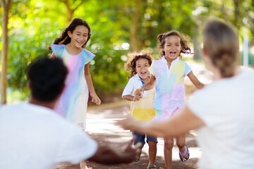 Family in summer park. Parents and kids outdoor.