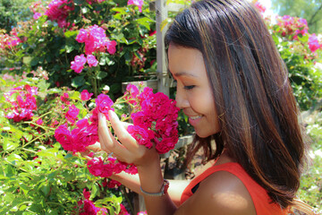 Woman smelling roses