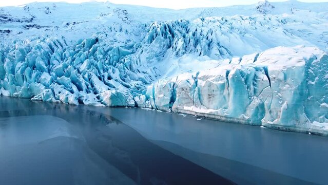 Glacier in Iceland, Huge Chunks of Blue Ice, Arctic landscape with new Icebergs, Aerial view, Global Warming and Climate Change Concept, Beautiful Nature background in 4k