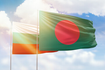 Sunny blue sky and flags of bangladesh and bulgaria