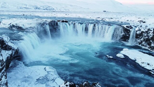 Spectacular aerial drone shot of mighty Godafoss waterfall in North Iceland during icy winter day. Famous landmark, Untouched arctic landscape