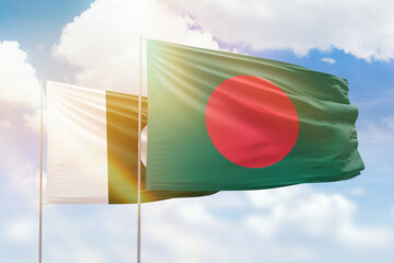 Sunny blue sky and flags of bangladesh and pakistan