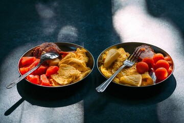 Breakfast with omelet and vegetables in plate