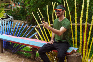 man working on his cell phone remotely