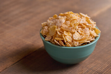 Rice Cereal in a Blue Bowl on a Wood Table