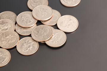 Coins on a black background- Quarters