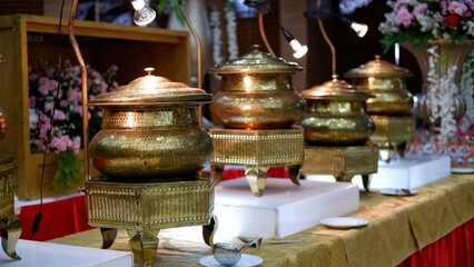 Catering services setup with golden brass