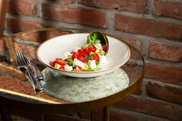 Tasty and healthy salad with arugula, brie cheese, avocado, cherry tomatoes and strawberry. Top view. The flat lay. Banner