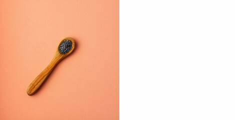 Organic poppy seeds wooden spoon - Papaver somniferum.