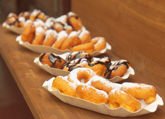 Mini donuts on offer at the farmers street food market in Karlín, Prague. - obrazy, fototapety, plakaty