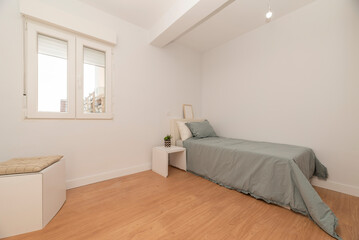 Fototapeta na wymiar bedroom with single beds with gray duvets, white furniture and white aluminum window with a view