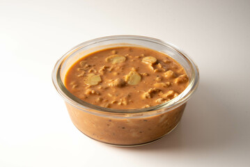 Stroganoff stored in glass bowl isolated on white background