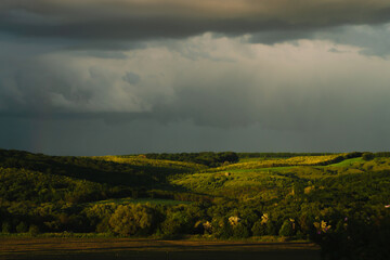 Obraz premium The sky after a thunderstorm on a summer evening in the rays of the sun