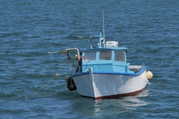 Fisherman on his boat fishing crustaceans in Brittany France