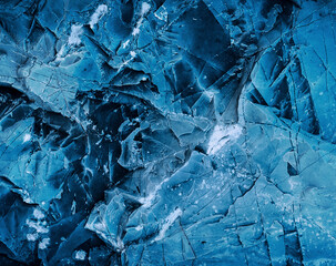 Splits in ice. Cool background. Ice cracks. Rock texture. Ice texture. Rough structure mineral. Stone background. Ice surface texture. Abstract texture. Lava frozen. Rock pile.