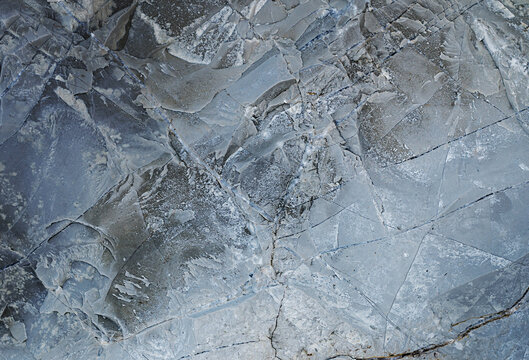 Cool Marble background. Ice cracks. Rock texture. Ice texture. Splits in ice. Rough structure mineral. Stone background. Ice surface texture. Abstract texture. Lava frozen. Rock pile.