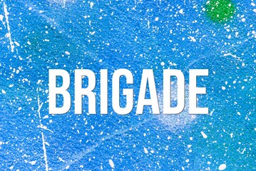 BRIGADE - word on concrete background. Cement floor, wall.