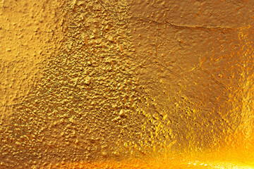 Abstract texture wall. Gold texture. Golden Ore rocks. Stone background. Rock pile. Stone texture. Structure. Shimmering surface. Precious Foil. Rough structure mineral. Rock texture.