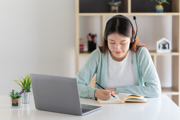 E-learning ,online ,education and internet social distancing protect from COVID-19 viruses concept. Asian woman student video conference e-learning with teacher on laptop computer at home.