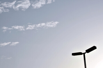 lamp post against sunset sky