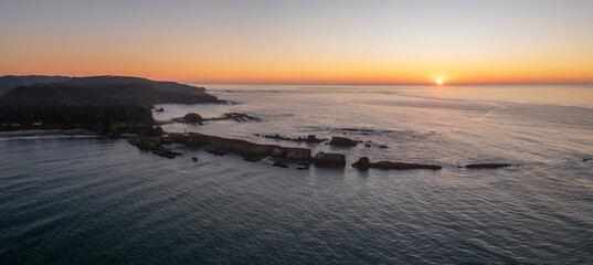 Cape Arago Lighthouse at the Oregon Coast at sunset.