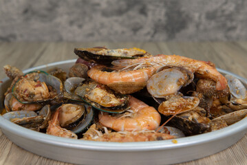 Delicious boiled seafood meal of shrimp, corn on the cobb, sausage, clams, and potatoes for tasty seafood meal
