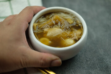 Fish maw soup (quail eggs, bamboo shoot, rice vermicelli and chicken) in mini bowl.