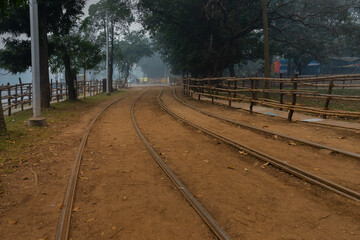 Kolkata, West Bengal, India - 23rd January 2020 : Electric Tram lines at Kolkata maidan area. It is...
