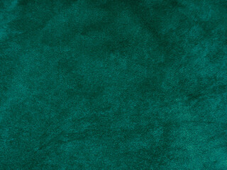 Dark green old velvet fabric texture used as background. Empty green fabric background of soft and smooth textile material. There is space for text..