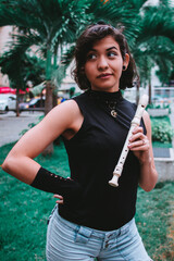 Girl with flute in park