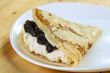 Pancake with cottage cheese and jam
