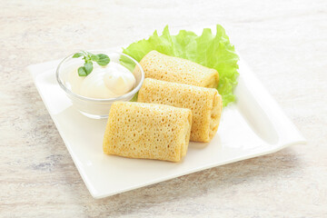 Stuffed pancakes with meat and cream