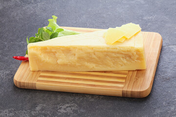 Parmesan cheese piece over board