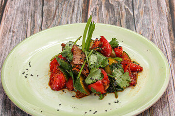 Spicy salad with beef and vegetables