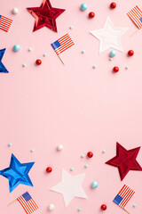 Obraz premium USA Independence Day concept. Top view vertical photo of US national flags star garland and scattered candies on isolated pastel pink background with copyspace