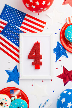 USA Independence Day concept. Top view vertical photo of photo frame with number 4 candle national flags balloons stars plates with donuts and confetti on isolated white background