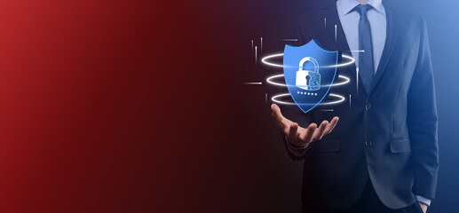 Businessman hold low poly polygon shield with a padlock icon.Secure Access System Concept.Business Financial Warranty for Investment.antivirus concept.Technology security.Protection network,safe data.