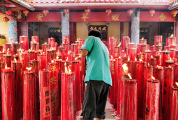 Big red candles in the temple. The temple is generally used as a place of worship/worship by most...