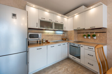 New modern white kitchen. New home. Interior photography.