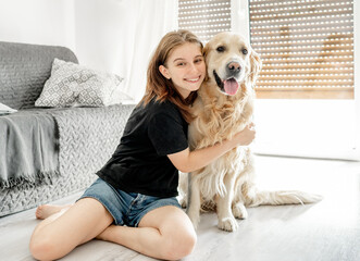 Girl with golden retriever dog