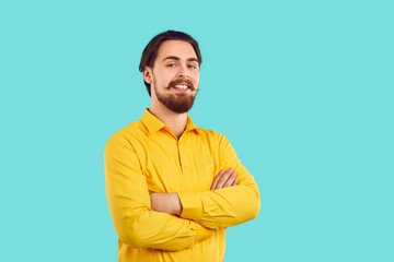 Portrait of handsome and happy man with stylish mustache and beard on light blue background....