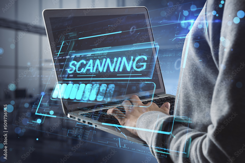 Poster close up of hacker using laptop with scanning hologram on blurry office interior background. access 