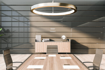 Front view on part of stylish conference table and chairs in sunlit meeting room with glossy wall, modern round lamp and wooden office cabinet on background. 3D rendering