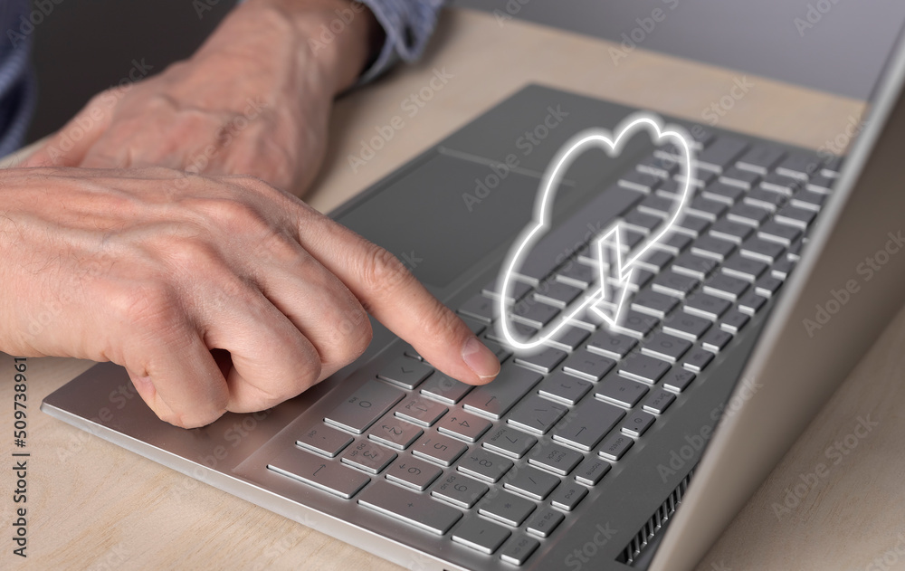 Aufkleber Cloud computing. Man using laptop for retrieving files from online storage. Forefinger closeup pressing on enter button. High quality photo