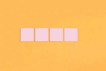 Pink sticky notes on an orange background