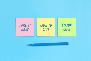 Sticky notes with handwritten motivational lettering