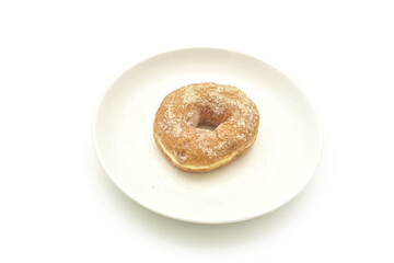 Sugar donut on white plate. isolated on white background