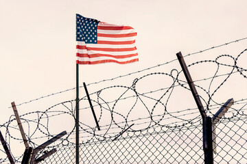 mexican border. Concept of United States of America closed borders with flag and wire fence. USA...